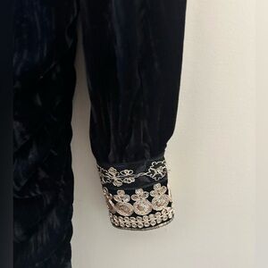 Stunning dress by souvenir rushed black dress deep v neck with gold detailing